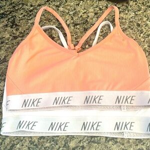 Two Nike size small ribbed sports bras